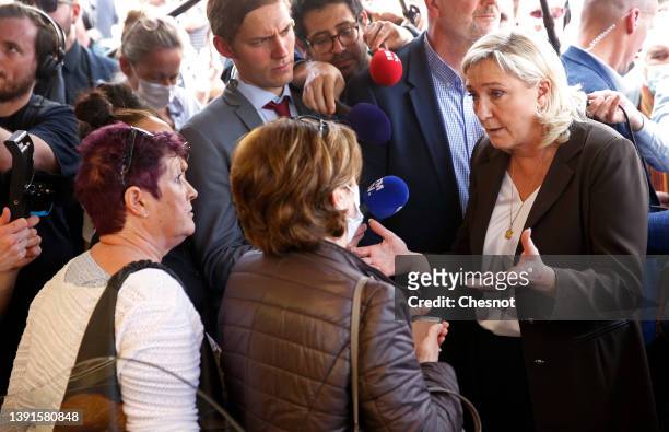 France's far-right party Rassemblement National leader, Marine Le Pen candidate for the 2022 French presidential election speaks with supporters as...