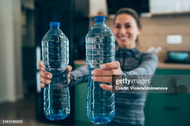 https://media.gettyimages.com/id/1391590220/photo/woman-workout-at-home-with-water-bottles.jpg?s=612x612&w=gi&k=20&c=xAFXe2IGV8hjJH7v37GBzvWJ1JI370lL3vPlUeJ_FOI=