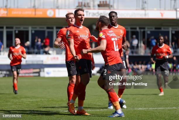 Kal Naismith of Luton Town celebrates with Robert Snodgrass after scoring their team's first goal during the Sky Bet Championship match between Luton...