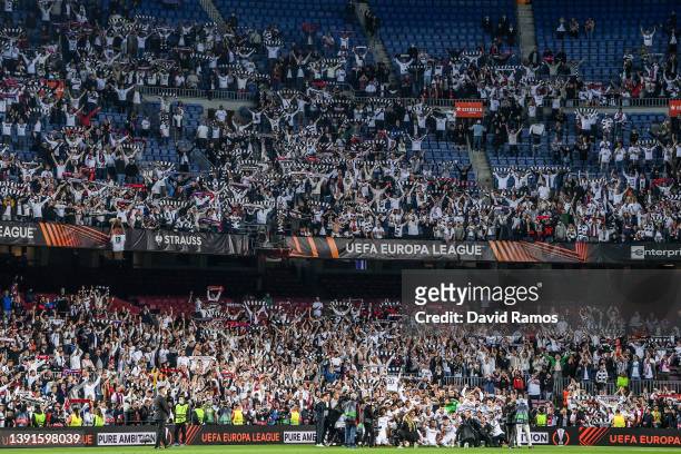 Eintracht Frankfurt players pose for a picture with his fan in the stands as they celebrate after the UEFA Europa League Quarter Final Leg Two match...