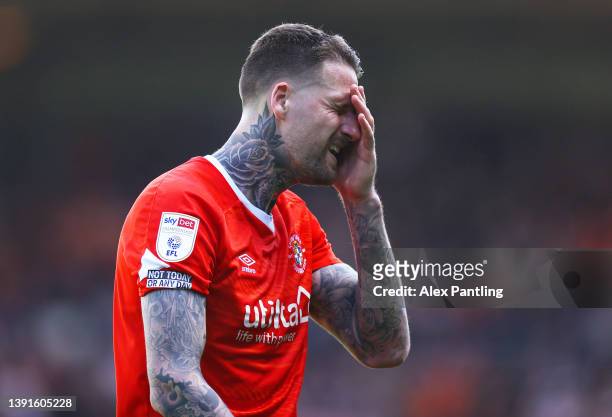 Sonny Bradley of Luton Town leaves the pitch after being red carded during the Sky Bet Championship match between Luton Town and Nottingham Forest at...