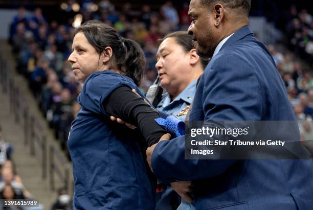 Woman tried to glue herself to the Target Center basketball court at Tuesday night's Minnesota Timberwolves game against the Los Angeles Clippers to...