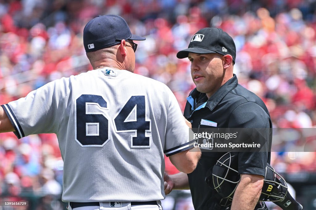 Merzel Home plate umpire Dan Merzel explains to New York Yankees bench coach ...