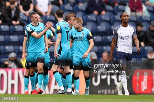 Murray Wallace of Millwall celebrates with teammates after scoring their team's first goal during the Sky Bet Championship match between Preston...