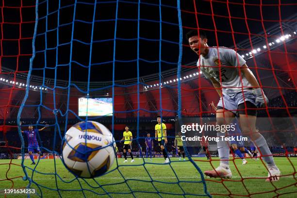 Goalkeeper He Lipan of Guangzhou FC reacts after conceding a second goal to Johor Darul Ta'zim during the first half of the AFC Champions League...
