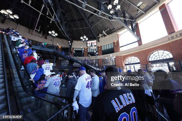 New York Mets fans enter the stadium during the Mets home opening game against the Arizona Diamondbacks at Citi Field on April 15, 2022 in New York...