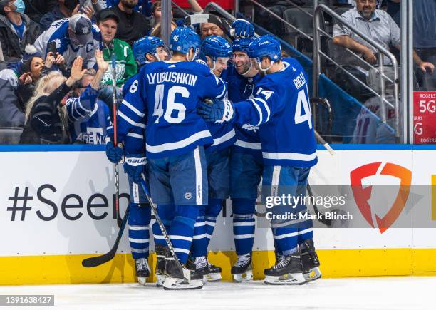 Ilya Mikheyev of the Toronto Maple Leafs celebrates his goal with John Tavares, Morgan Rielly, Ilya Lyubushkin, and Alexander Kerfoot against the...