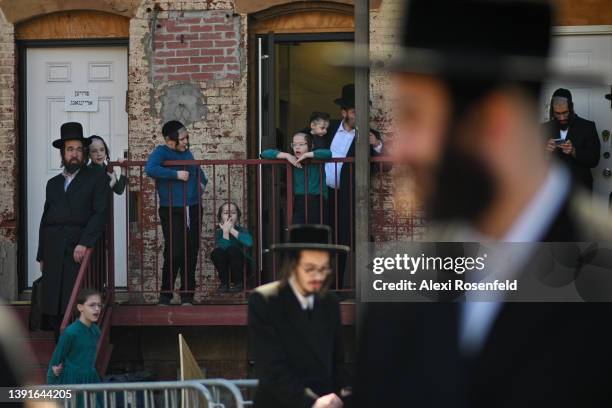 Orthodox Jews participate in the "biur chametz," a burning leavened food ritual, before the week-long Passover holiday in Williamsburg on April 15,...