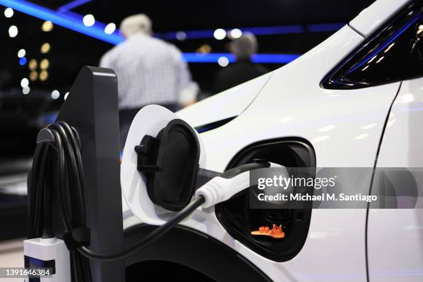 Charging Chevrolet Bolt EV is seen at the New York International Auto Show at the Jacob K. Javits Convention Center on April 15, 2022 in New York...