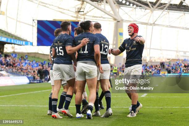 James Lowe celebrates with teammate Josh van der Flier of Leinster after scoring a try during the Heineken Champions Cup Round of 16 Leg Two match...