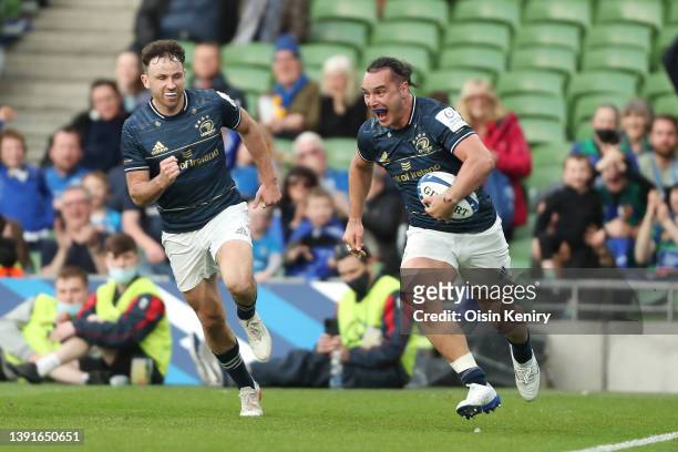 James Lowe of Leinster runs with the ball before scoring a try during the Heineken Champions Cup Round of 16 Leg Two match between Leinster Rugby and...