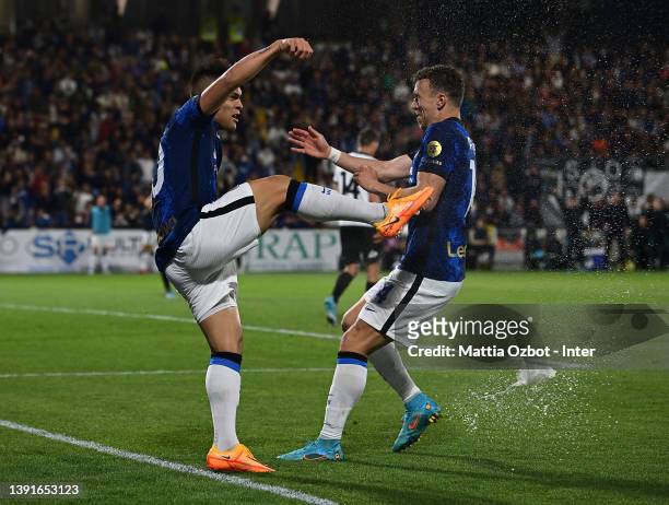 Lautaro Martinez of FC Internazionale celebrates with teammate Ivan Perisic after scoring the second goal during the Serie A match between Spezia...