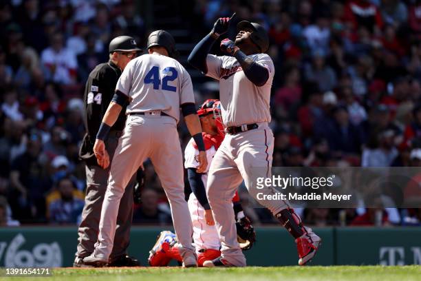 Miguel Sano of the Minnesota Twins celebrates after hitting a two run home run against the Boston Red Sox during the second inning on Opening Day at...