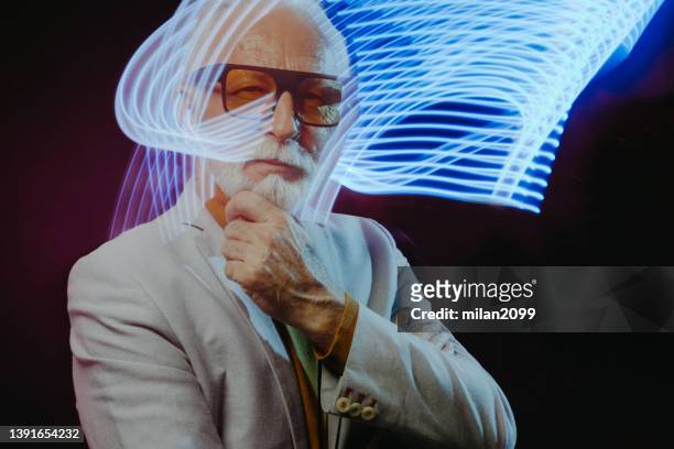 senior man - portrait - light painting stock pictures, royalty-free photos & images