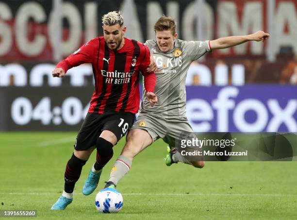 Theo Hernandez of AC Milan is challenged by Morten Frendrup of Genoa during the Serie A match between AC Milan and Genoa CFC at Stadio Giuseppe...