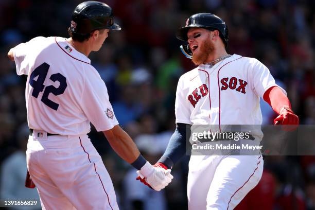 Alex Verdugo of the Boston Red Sox celebrates with Bobby Dalbec after hitting a home run during the second inning against the Minnesota Twins on...