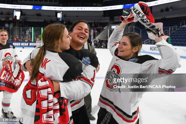 Brooke Bink of the Ohio State Buckeyes celebrates with Sophie Jaques and Kenzie Hauswirth after defeating the Minnesota Duluth Bulldogs 3-2 during...