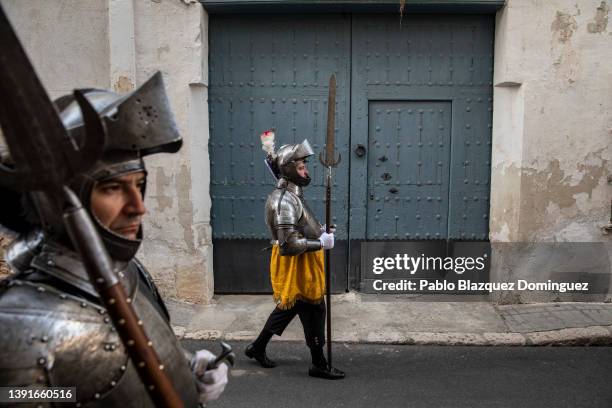 Armoured penitents from the 'Armados de Jesus Nazareno' brotherhood walk before the start of 'Las Caidas' procession on Good Friday on April 15, 2022...