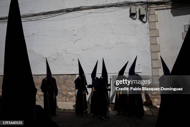 Penitents from the 'Nuestro Padre Jesus Nazareno' brotherhood take part in 'Las Caidas' procession on Good Friday on April 15, 2022 in Ocana, Spain....