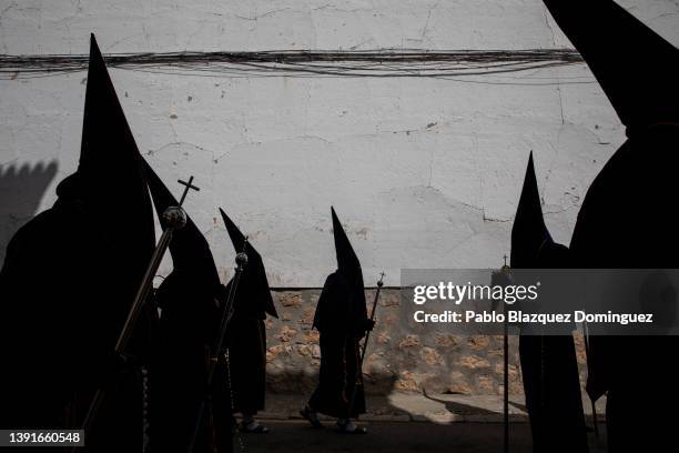 Penitents from the 'Nuestro Padre Jesus Nazareno' brotherhood take part in 'Las Caidas' procession on Good Friday on April 15, 2022 in Ocana, Spain....