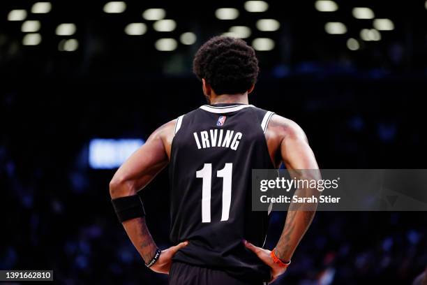 Kyrie Irving of the Brooklyn Nets looks on during the second half of the Eastern Conference 2022 Play-In Tournament against the Cleveland Cavaliers...