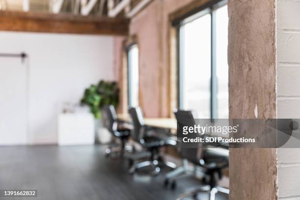focus on wall in foreground at entry to loft office - focus on foreground stock pictures, royalty-free photos & images