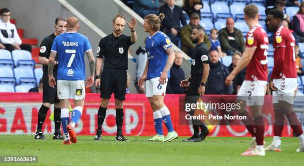 Carl Piergianni of Oldham Athletic remonstrates with referee Ben Purkis having been shown a red card during the Sky Bet League Two match between...