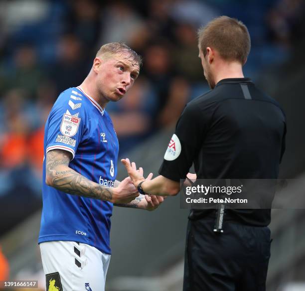 Nicky Adams of Oldham Athletic looks to referee Ben Purkiss after the award of a free kick which led to Northampton Town's first goal during the Sky...