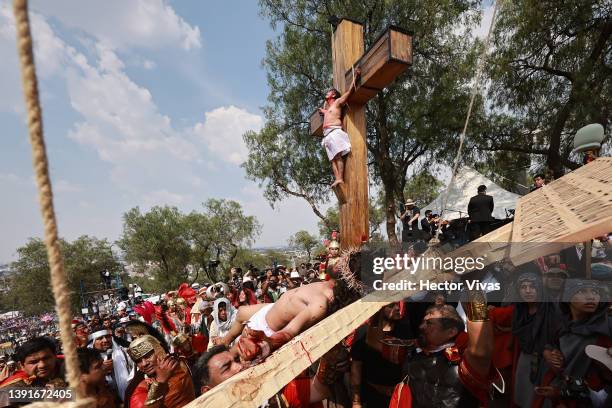 An actor representing Jesus Christ is crucified during the Passion Play of Iztapalapa on April 15, 2022 in Mexico City, Mexico. Iztapalapa, one of...