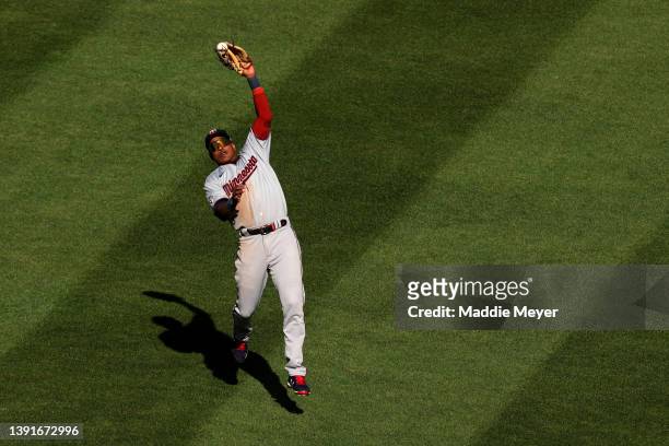 Jorge Polanco of the Minnesota Twins catches a fly ball hit by Rafael Devers of the Boston Red Sox during the sixth inning on Opening Day at Fenway...