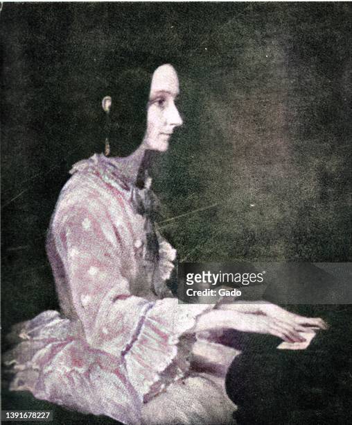 Colorized image of English mathematician and writer Ada Lovelace, seated in profile and playing piano, attributed to Henry Wyndham Phillips, 1852....