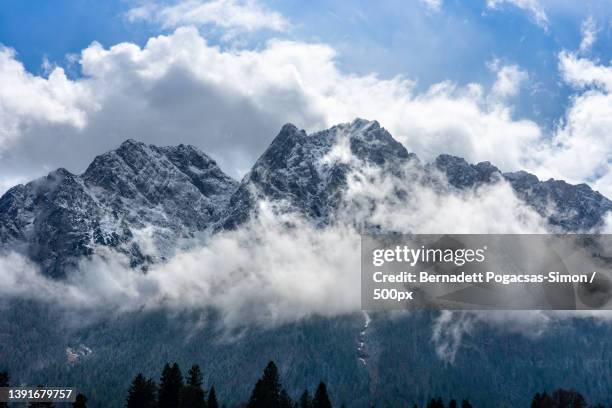 cloud around the zugspitze the biggest mountain of germany - bavarian alps stock-fotos und bilder