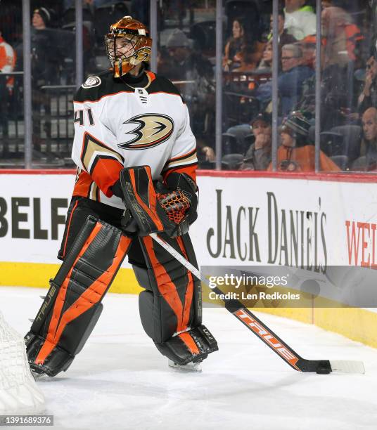 Anthony Stolarz of the Anaheim Ducks handles the puck behind the net against the Philadelphia Flyers at the Wells Fargo Center on April 9, 2022 in...