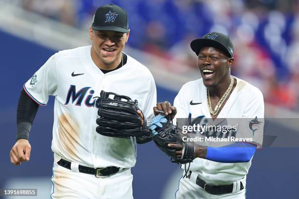 Avisail Garcia and Jazz Chisholm Jr. #2 of the Miami Marlins laugh during the sixth inning against the Philadelphia Phillies at loanDepot park on...