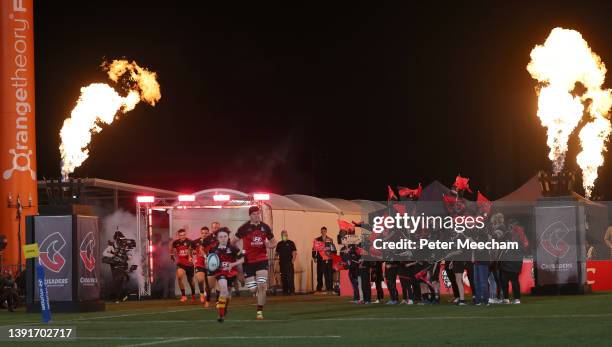 Crusaders captain Scott Barrett with a young fan who got to bring the ball out during the round four Super Rugby Pacific match between the Crusaders...