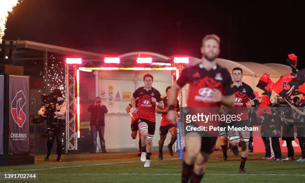 Crusaders players run out from the tunnel during the round four Super Rugby Pacific match between the Crusaders and the Chiefs at Orangetheory...