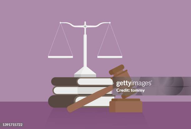 stockillustraties, clipart, cartoons en iconen met equal-arm balance, a book, and a gavel on a table - wetgeving