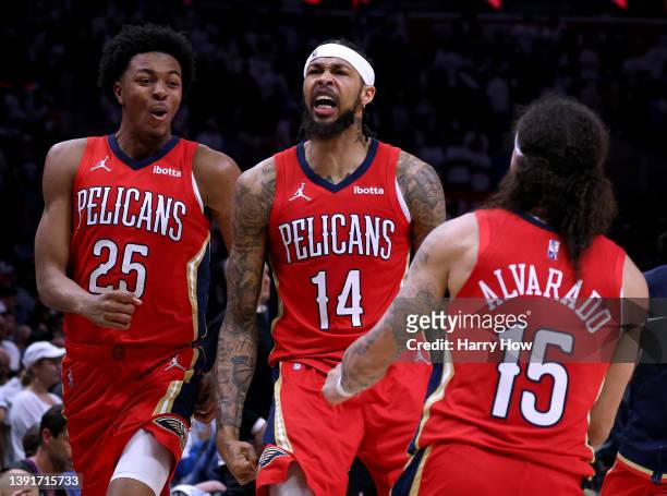 Brandon Ingram Jose Alvarado and Trey Murphy III of the New Orleans Pelicans celebrate a 105-101 win over the LA Clippers during an NBA play-in...