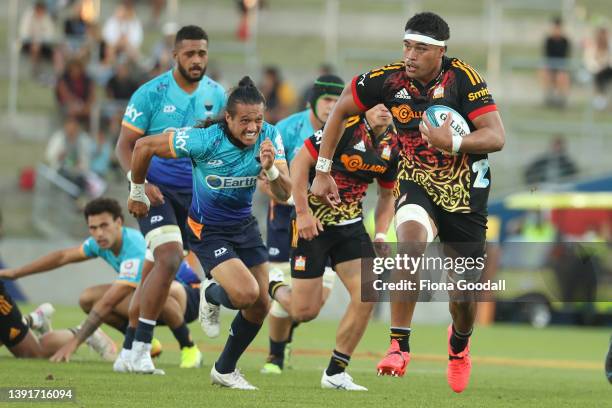 Tupou Vaa’i of the Chiefs makes a break during the Super Rugby Pacific match between the Moana Pasifika and the Chiefs at FMG Stadium Waikato on...