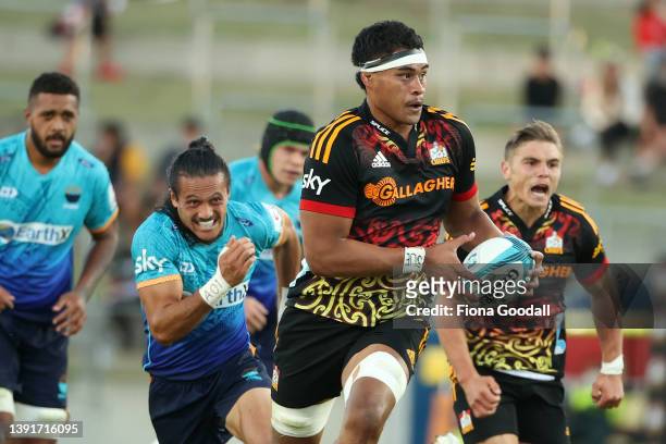 Tupou Vaa’i of the Chiefs makes a break during the Super Rugby Pacific match between the Moana Pasifika and the Chiefs at FMG Stadium Waikato on...
