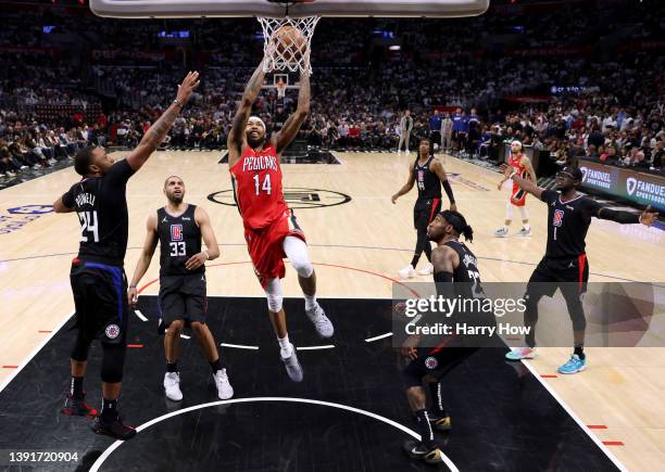 Brandon Ingram of the New Orleans Pelicans dunks between Norman Powell, Nicolas Batum, Robert Covington and Reggie Jackson of the LA Clippers during...