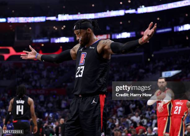 Robert Covington of the LA Clippers appeals to the crowd for noise during a 105-101 Pelican win in an NBA play-in tournament game at Crypto.com Arena...