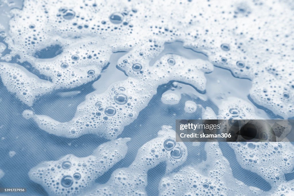 Top view movement of bath foam inside bathtub copy space