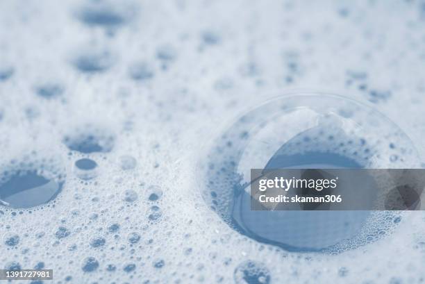 close up bubbles of bath foam inside the bathtub and copyspace - overflowing bathtub stock pictures, royalty-free photos & images