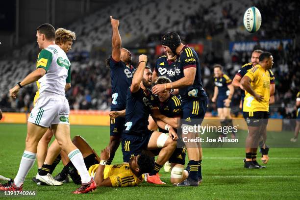 Max Hicks of the Highlanders celebrates after scoring a try during the round nine Super Rugby Pacific match between the Highlanders and the...