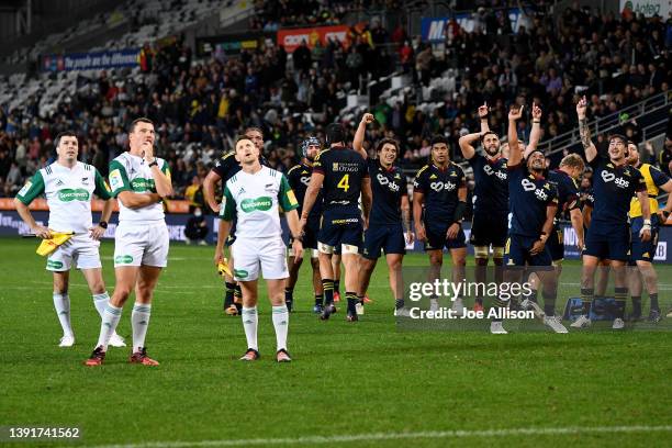 Referees Paul Williams, Angus Mabey and Mike Winter look towards the big screen as the Highlanders react during the round nine Super Rugby Pacific...