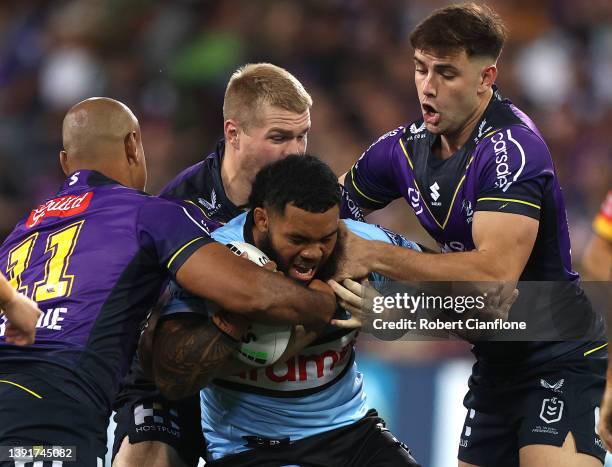 Siosifa Talakai of the Sharks is tackled during the round six NRL match between the Melbourne Storm and the Cronulla Sharks at AAMI Park, on April 16...