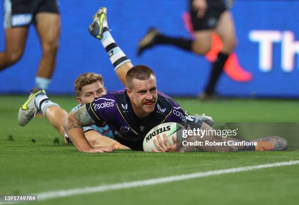 Cameron Munster of the Storm scores a try during the round six NRL match between the Melbourne Storm and the Cronulla Sharks at AAMI Park, on April...