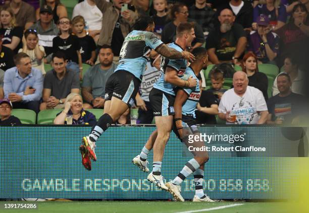 Ronaldo Mulitalo of the Sharks celebrates after scoring a try during the round six NRL match between the Melbourne Storm and the Cronulla Sharks at...