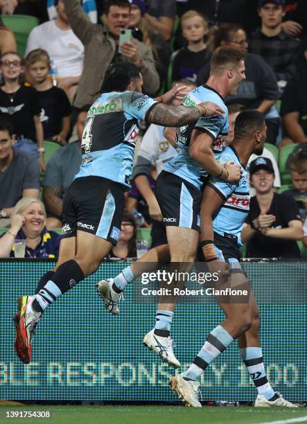 Ronaldo Mulitalo of the Sharks celebrates after scoring a try during the round six NRL match between the Melbourne Storm and the Cronulla Sharks at...